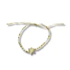 Bracciale regolabile con fiore di madreperla e perline di vetro